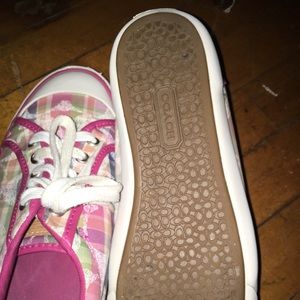 Two pair of coach shoes